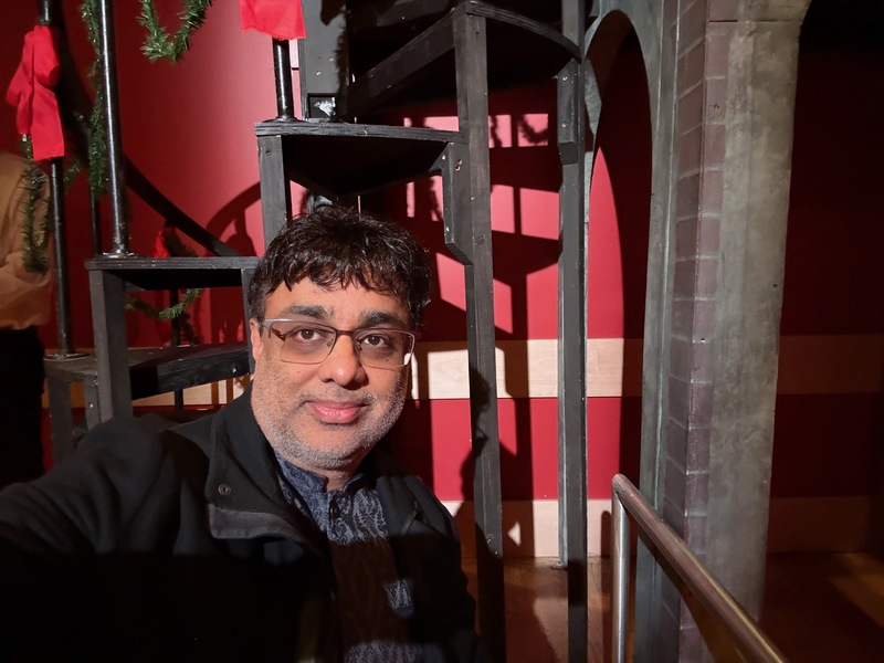 Rajiv by the spiral staircase that was part of the set