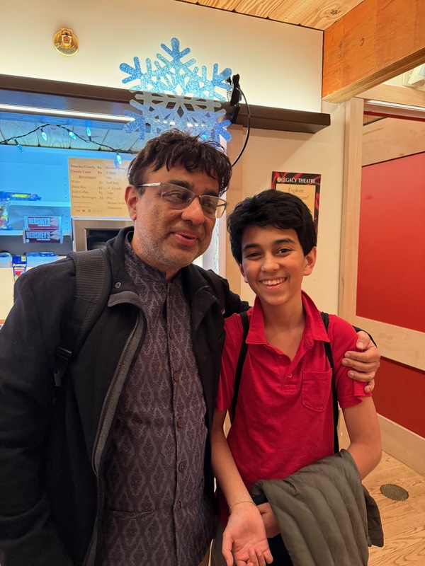 Rajiv and Fitz together in the theater lobby after the show