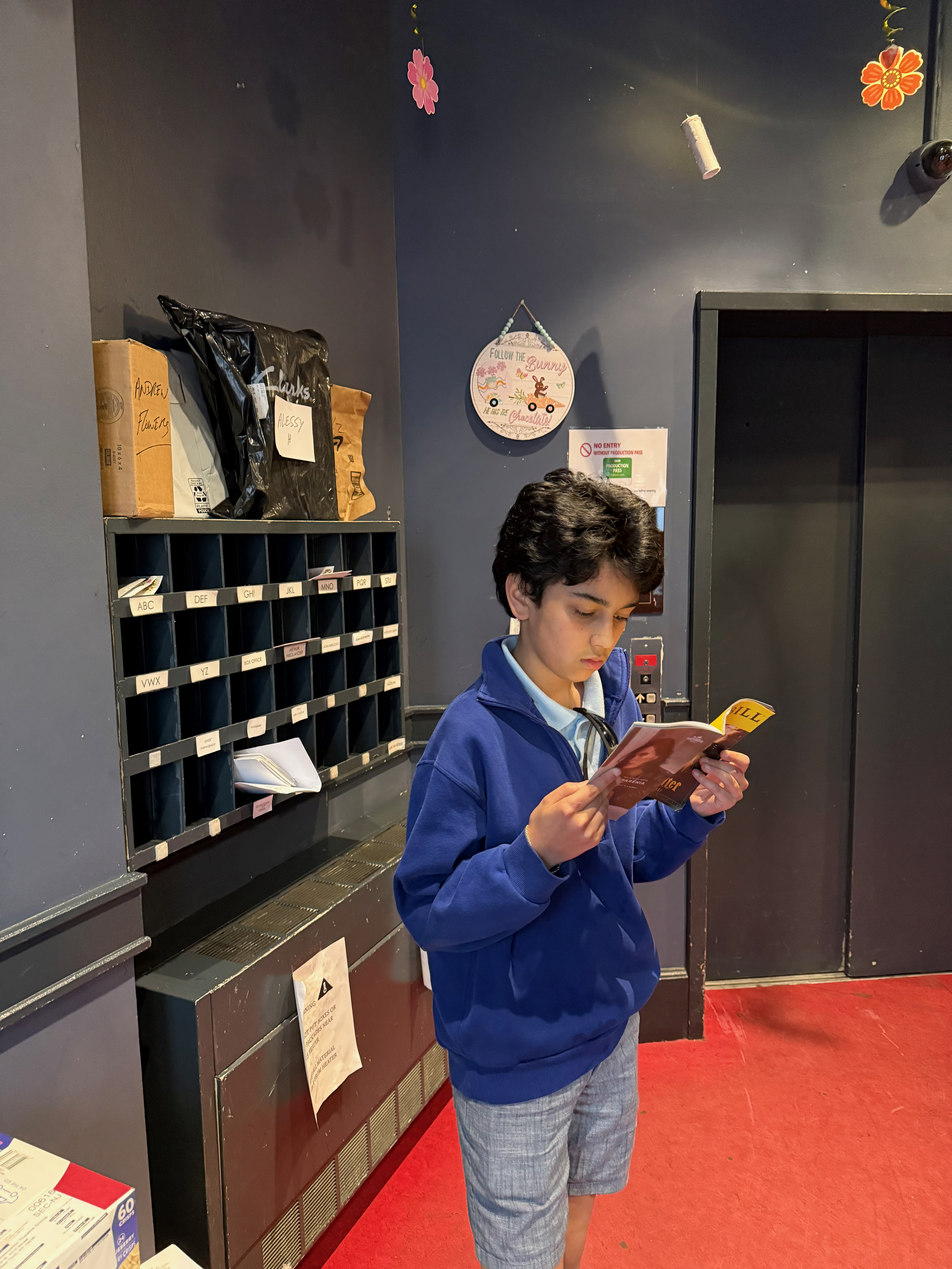 Fitz reading the Showbill while we waited