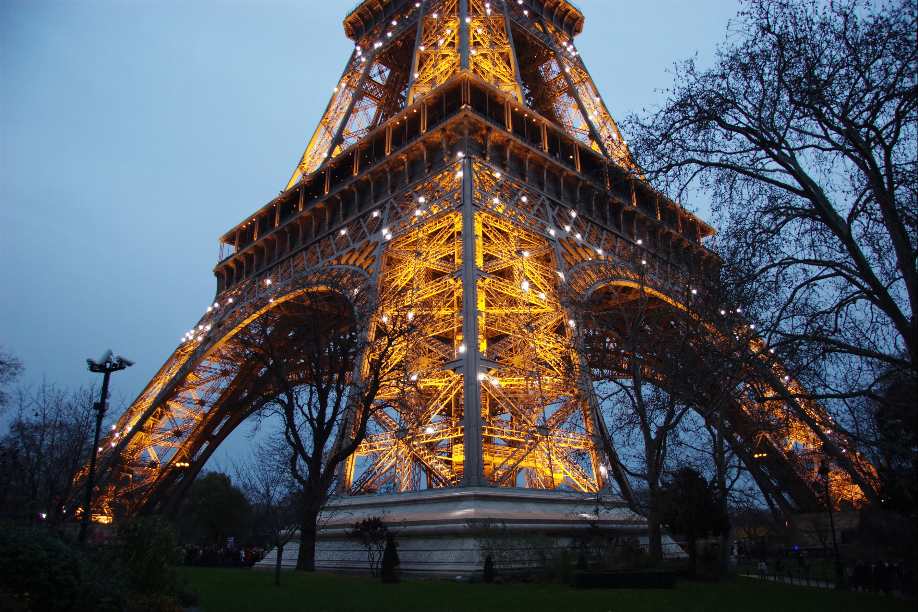 The Eiffel Tower illuminated at dusk